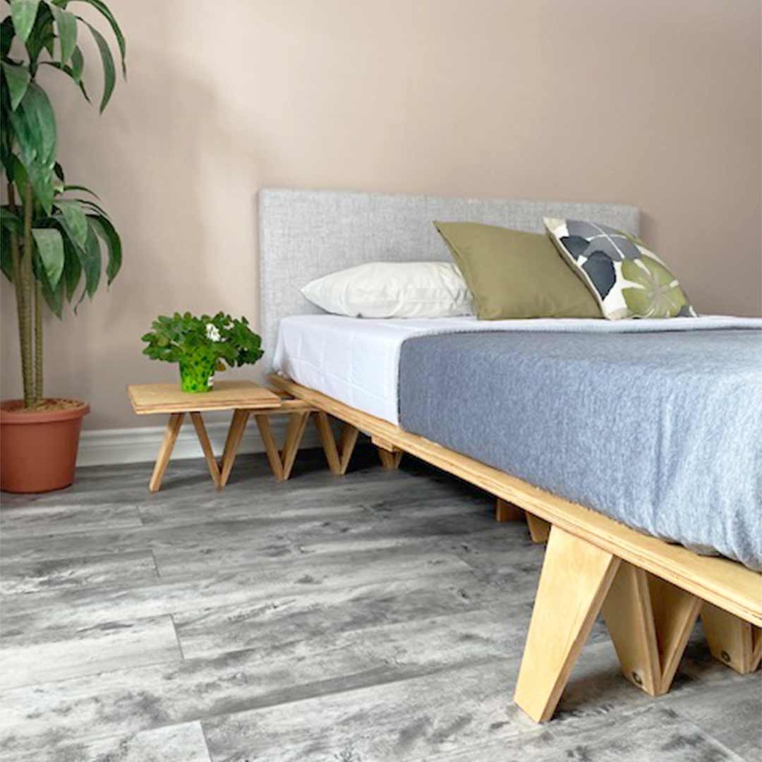 Flex bed frame in bedroom with mattress and pillows.